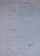 Kirsten writes out 'The More It Snows' in runes